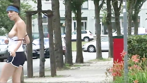 Perv chick walking in the street and flashing her big natural boobs