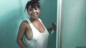 Young Latina with big naturals gets her big juggs wet in shower