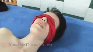 A thin German woman is tied up and blindfolded