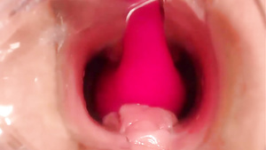 Kinky babe gives a close-up view of a dildo in her pussy