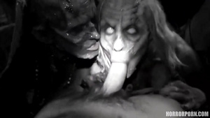 Two horny zombies catch a guy at the cemetery & tag team him