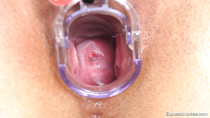 Kinky nurse plays with her shaved pussy on gynecological chair