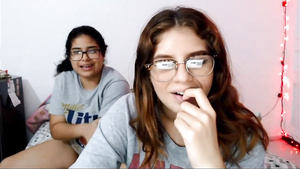 Two nerdy latinas playing with their pussies on cam