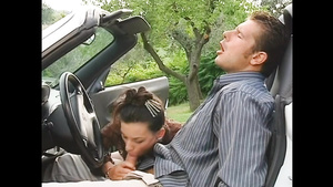 Amazing babe blows his thick dick in the car