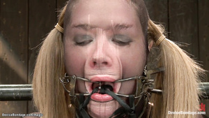 Strapped babe riding vibrator on stick