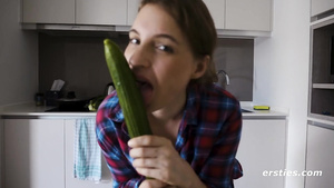 Gorgeous Julia has fun with long green cucumber