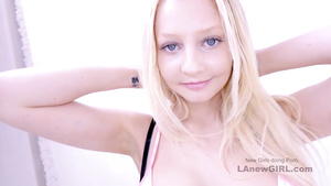 Stunning Blond Hair Babe with provocative outfit rimming in studio