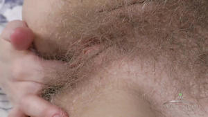 Amateur hairy cunt fingering herself close up