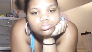 Young chubby ebony on webcam in solo video